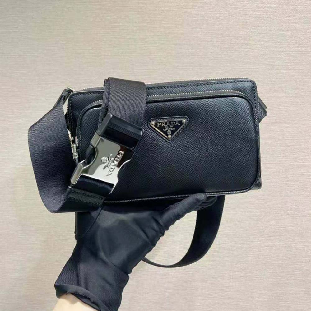 Close-up detail of Prada logo plate on belt bag leather surface