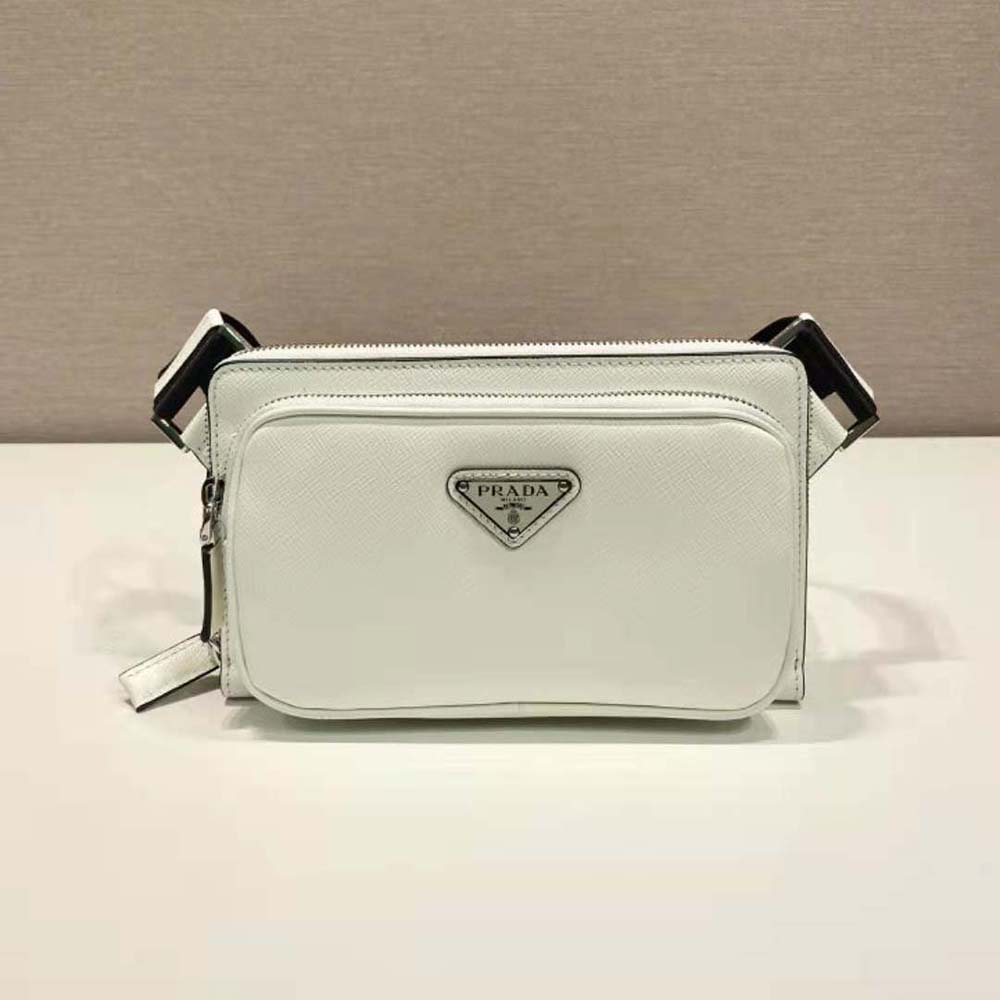 Side angle showing silver hardware and adjustable strap on Prada bag