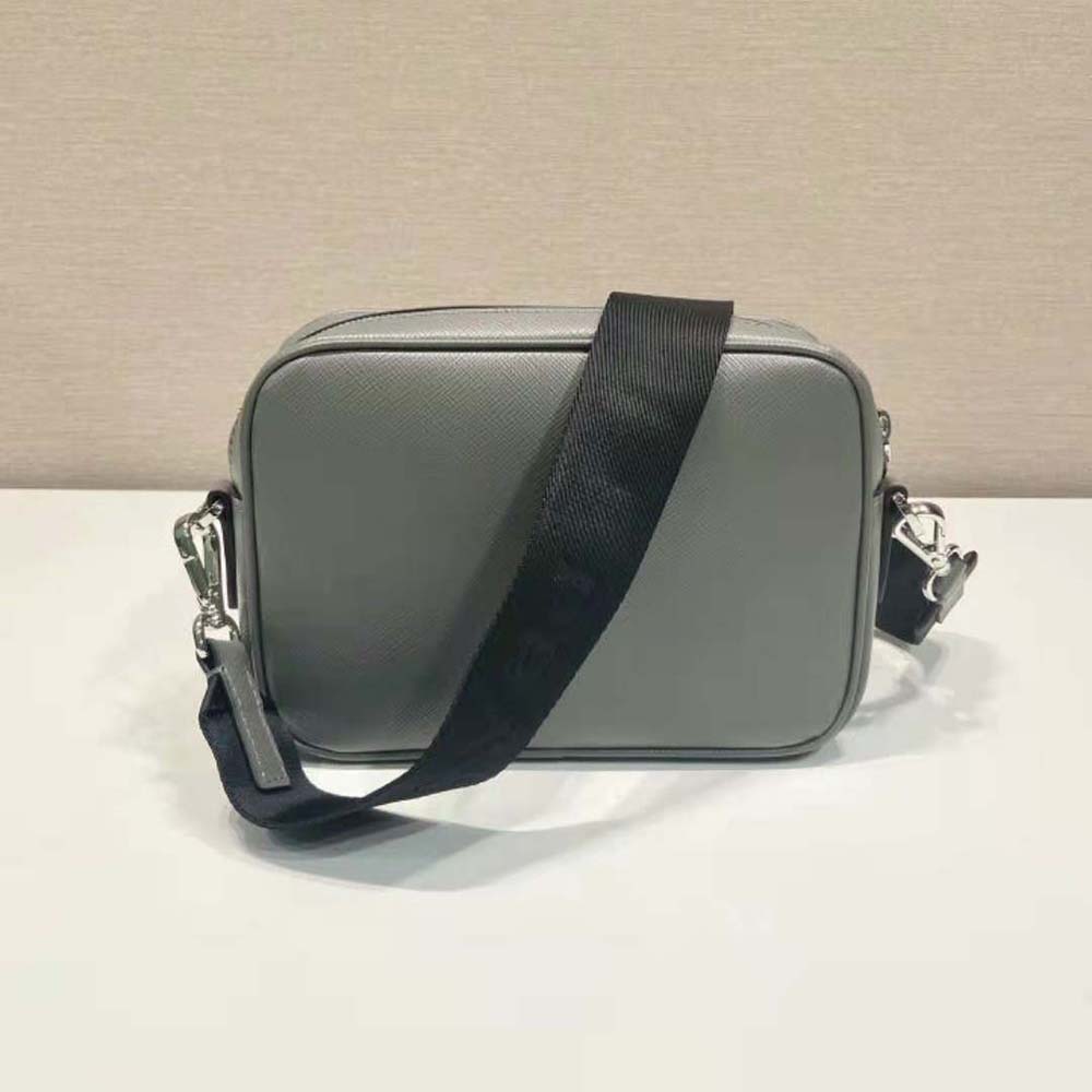 Side angle showing adjustable strap and compact shape of Prada bag