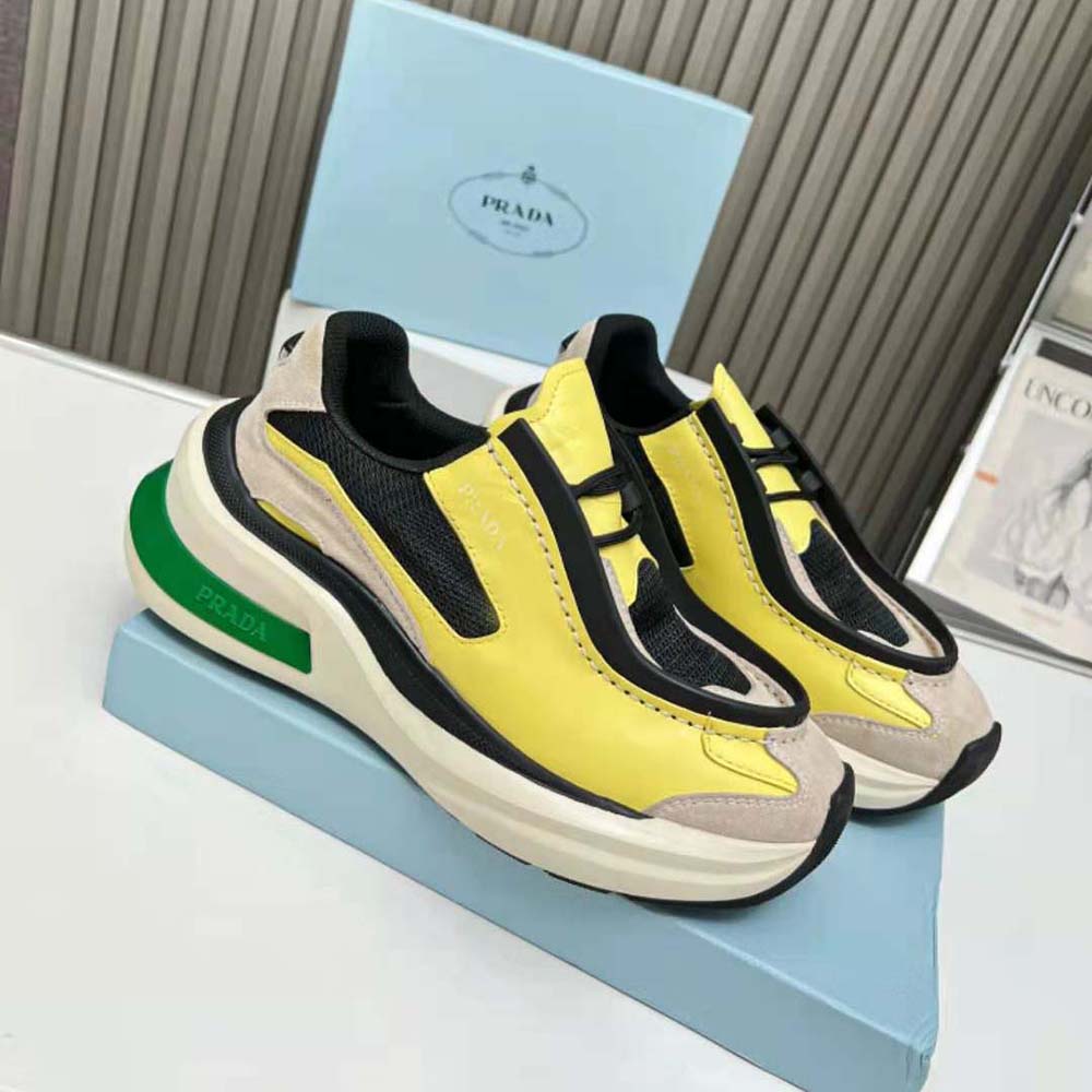 Close-up of yellow brushed leather and suede detailing on Prada Men Systeme Sneakers