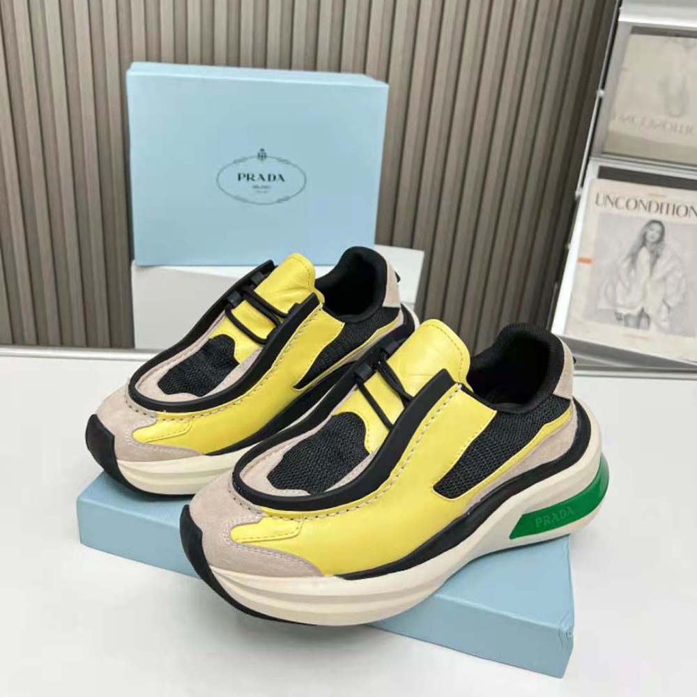 Top-down view showing lace closure and Prada logo on yellow leather sneakers
