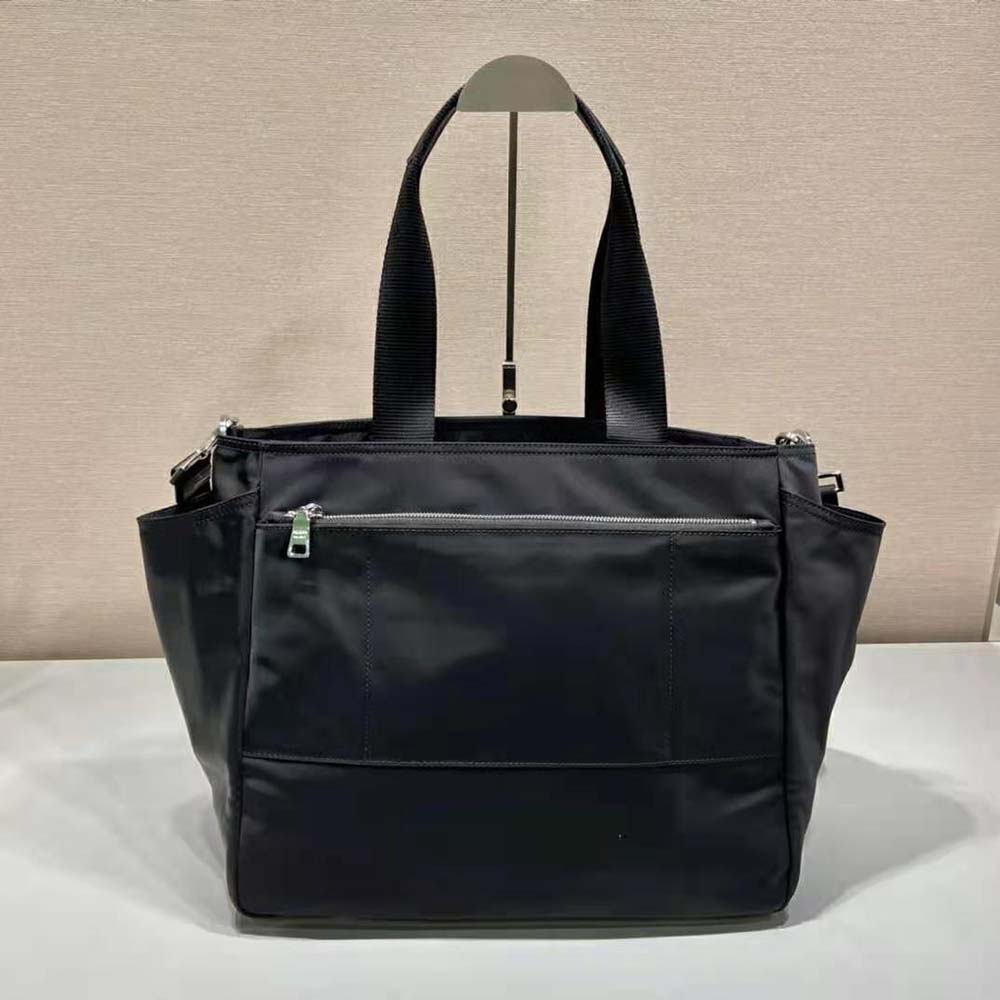 Side profile showing compact silhouette of Prada Unisex Re-Nylon Baby Bag