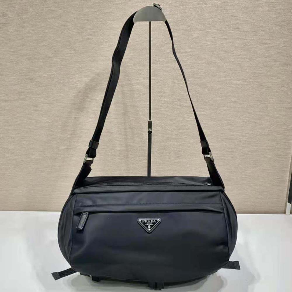 Close-up detail of Prada logo and silver hardware on shoulder bag