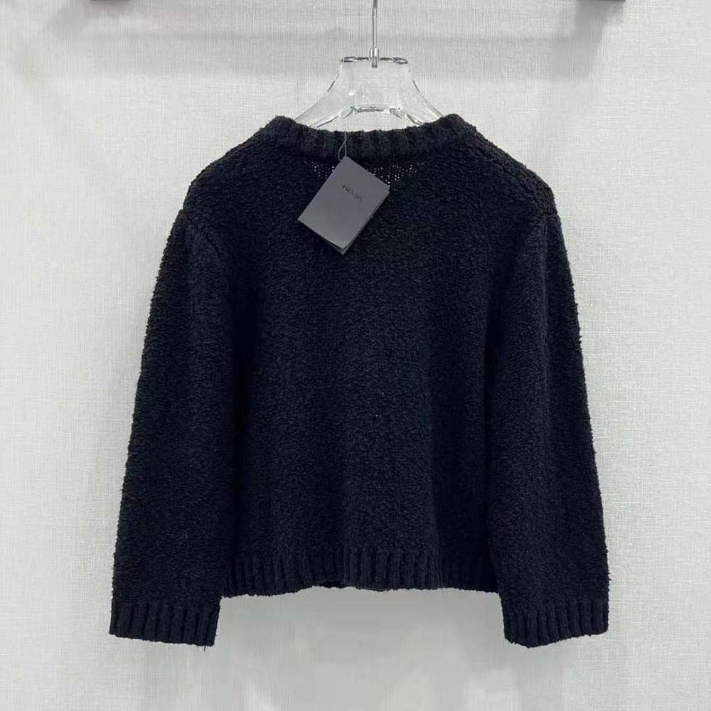 Side profile of Prada Women Bouclé Mohair Cardigan-Black highlighting relaxed silhouette