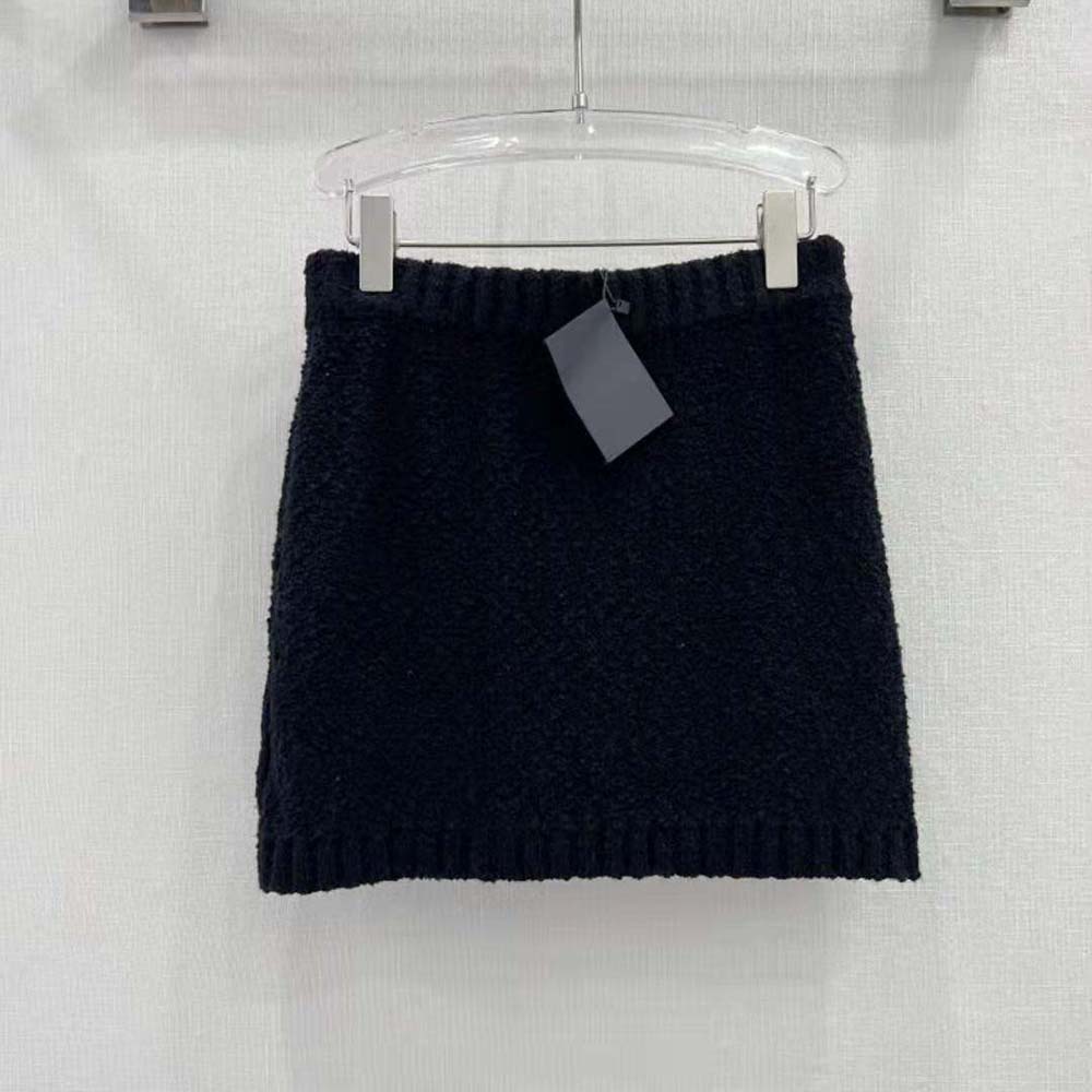 Side angle showing tailored fit of Prada Women Bouclé Mohair Miniskirt-Black