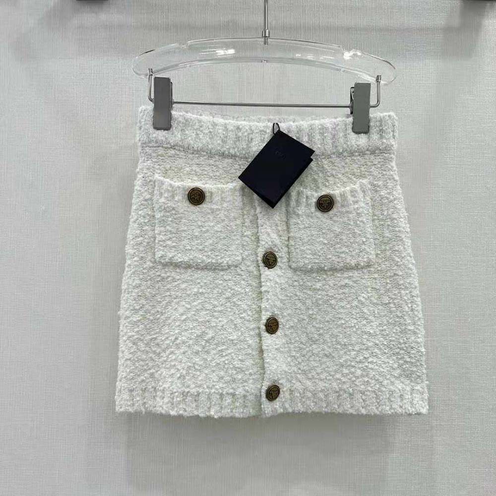 Close-up of mohair fabric and button closure on Prada miniskirt