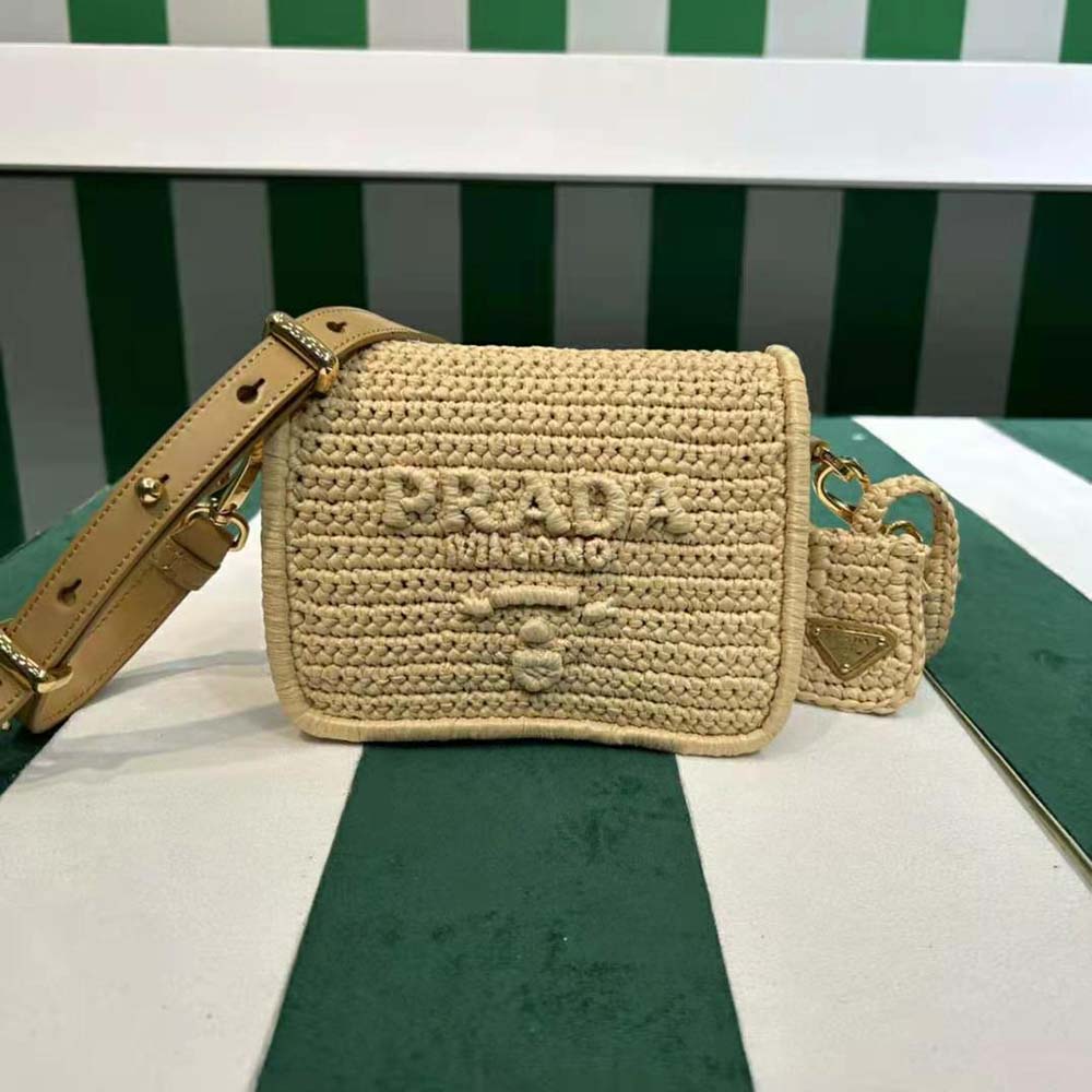 Close-up detail of crochet and leather texture on Prada shoulder bag