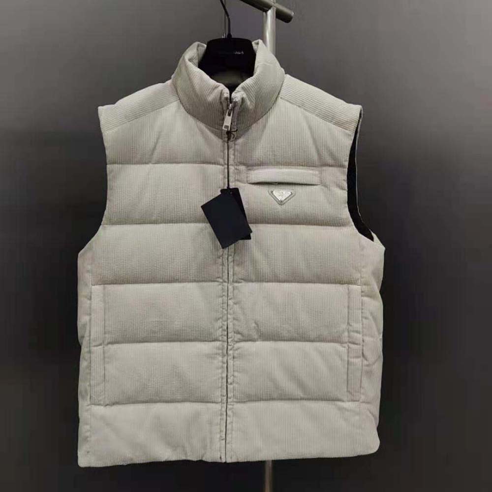 Close-up of silver zip and Prada logo on cropped corduroy vest