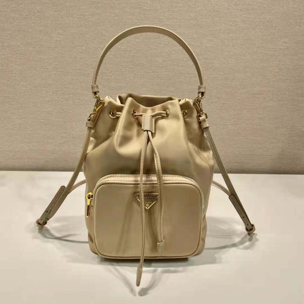 Close-up of beige Re-Nylon fabric and stitching on Prada bucket bag