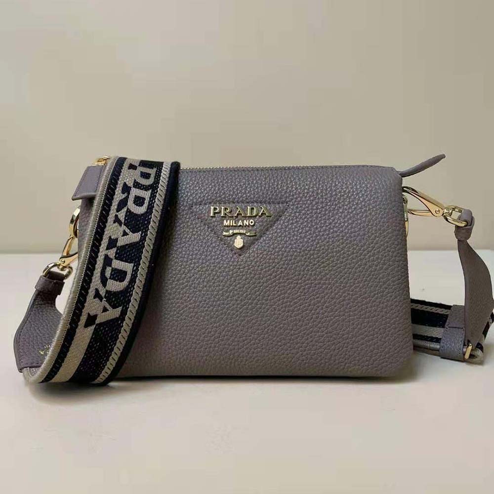Close-up of silver metal lettering logo on Prada Women Leather Shoulder Bag