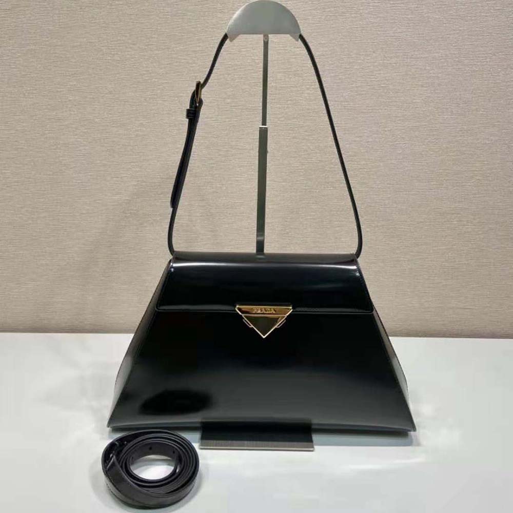 Close-up of brushed leather texture and silver hardware on Prada handbag