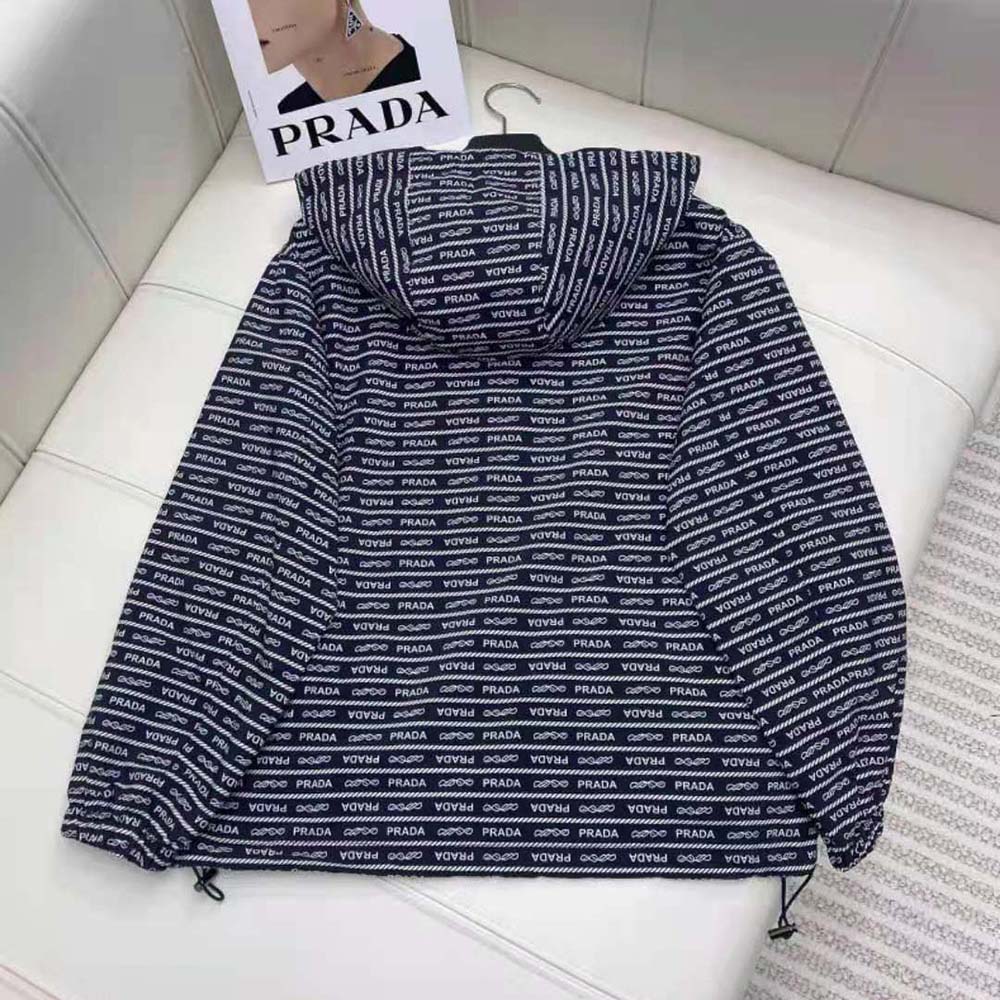 Side profile showing blue nylon and white accents of Prada jacket