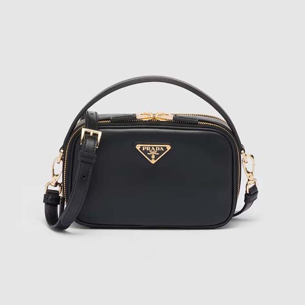 Front view of Prada Women Odette Leather Mini-bag-Black with gold logo