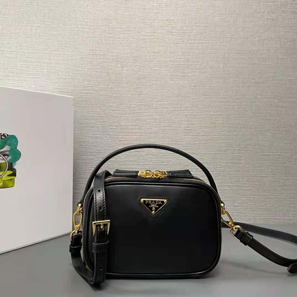 Side angle showing slim profile and adjustable strap of Prada Odette bag