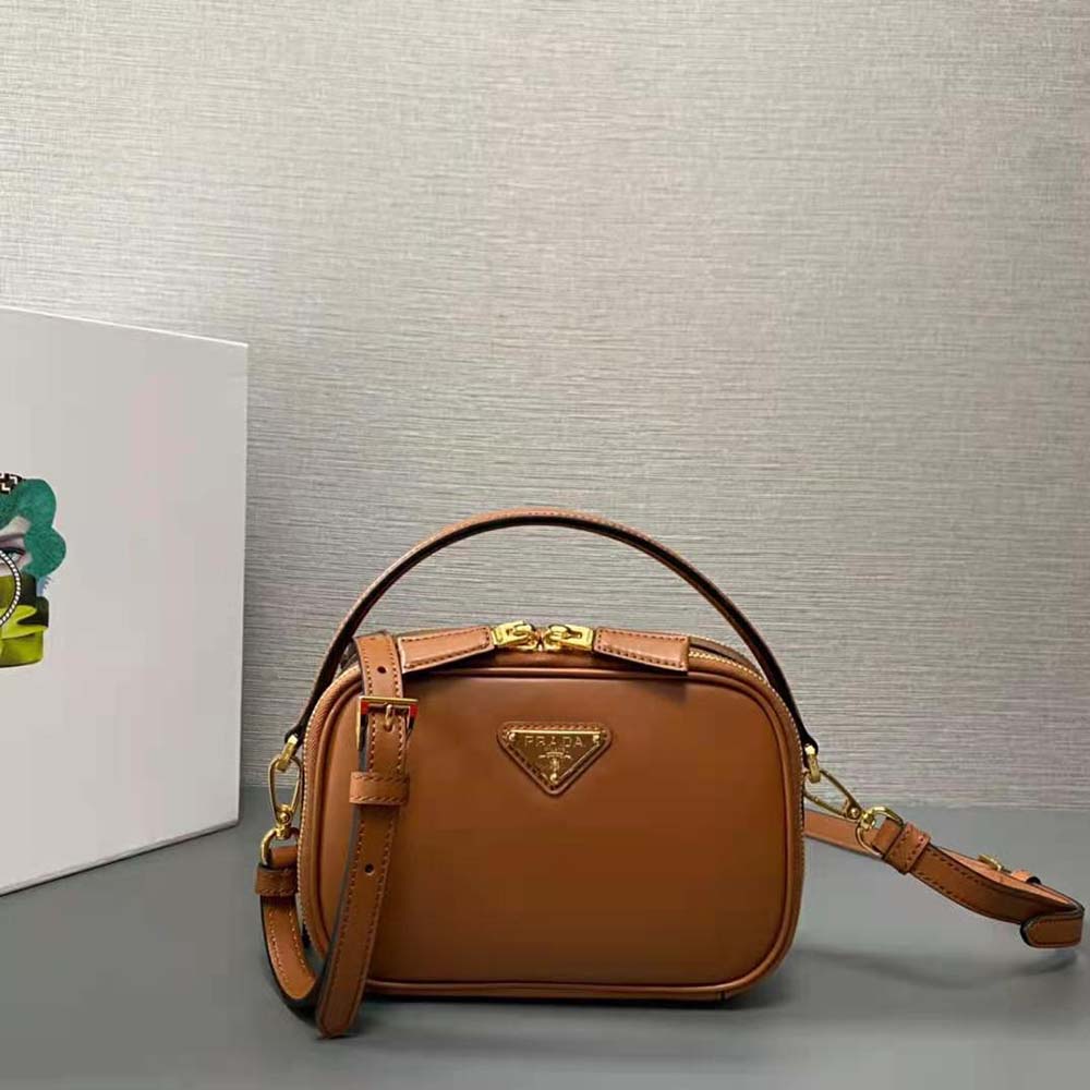Side angle showing silhouette and texture of Prada Women Odette Leather Mini-bag-Brown