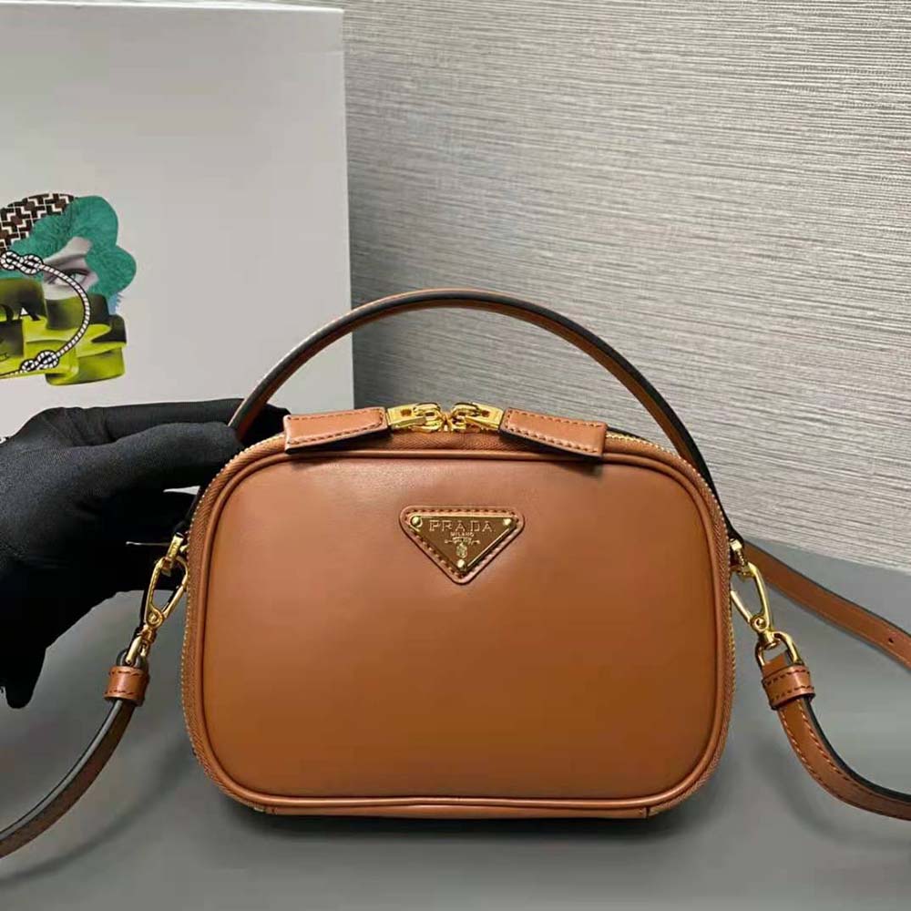 Close-up of gold-tone hardware on Prada Women Odette Leather Mini-bag-Brown