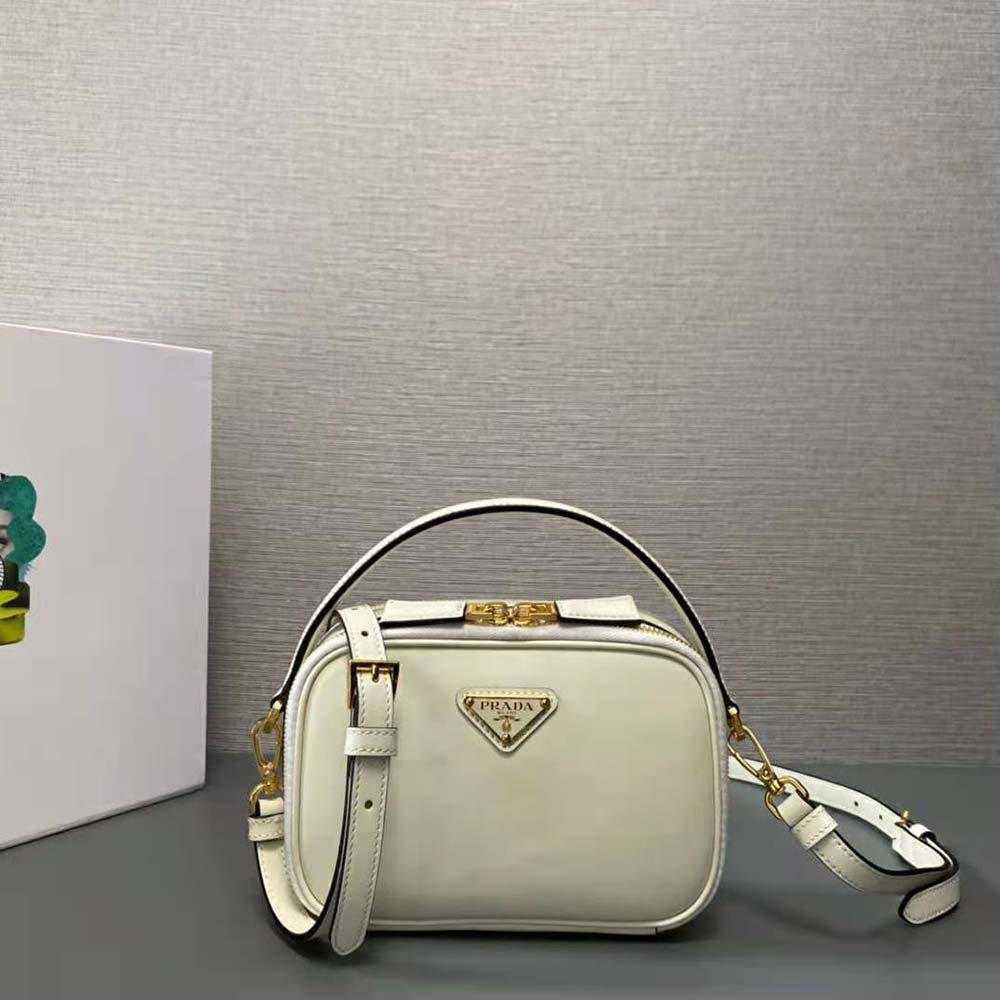 Side angle showing slim profile of Prada Women Odette Leather Mini-bag