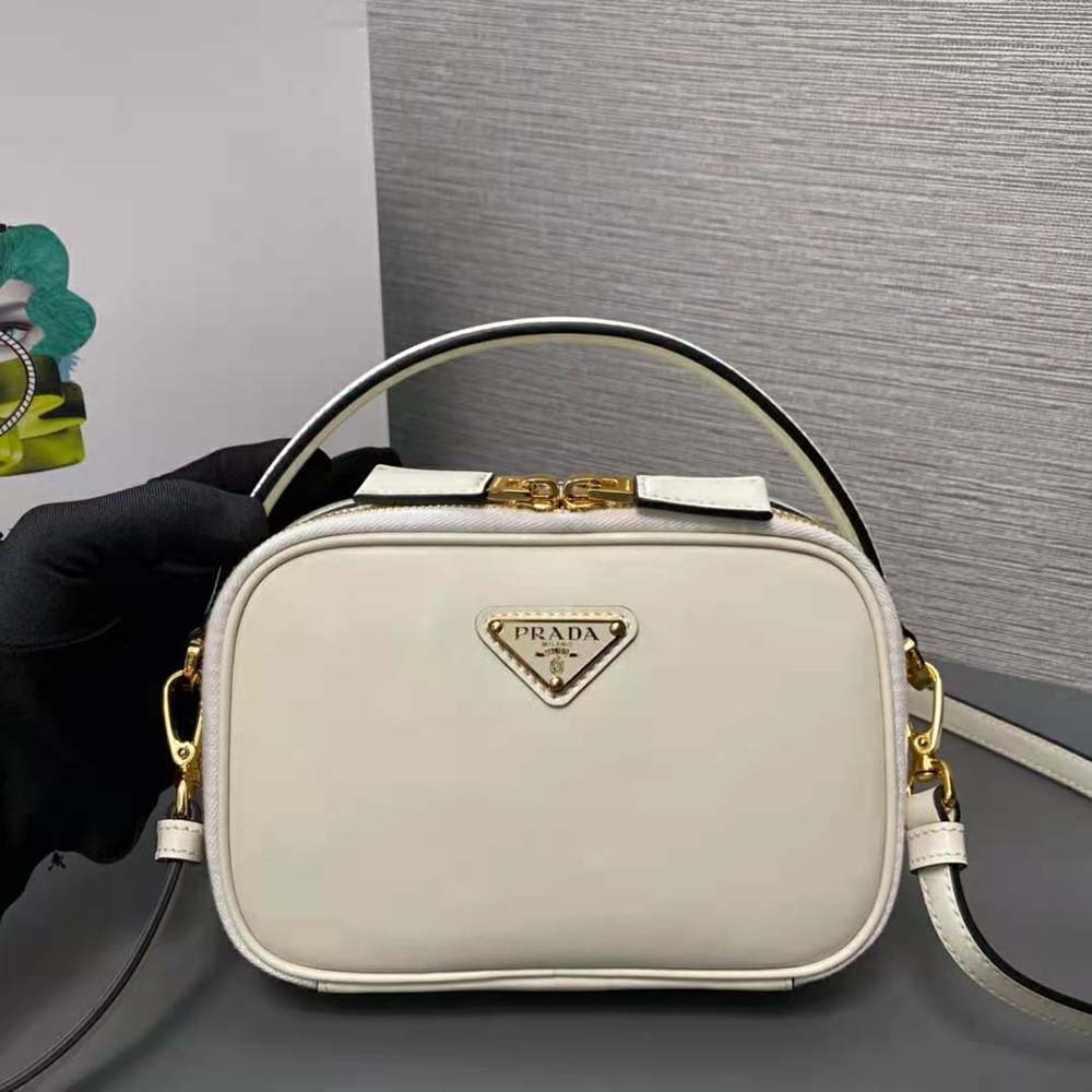 Close-up of white leather texture and Prada logo on Odette Mini-bag