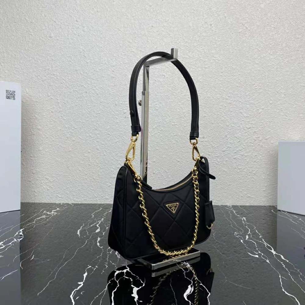 Side angle showing sleek silhouette of Prada Re-Edition 1995 Chaîne mini-bag