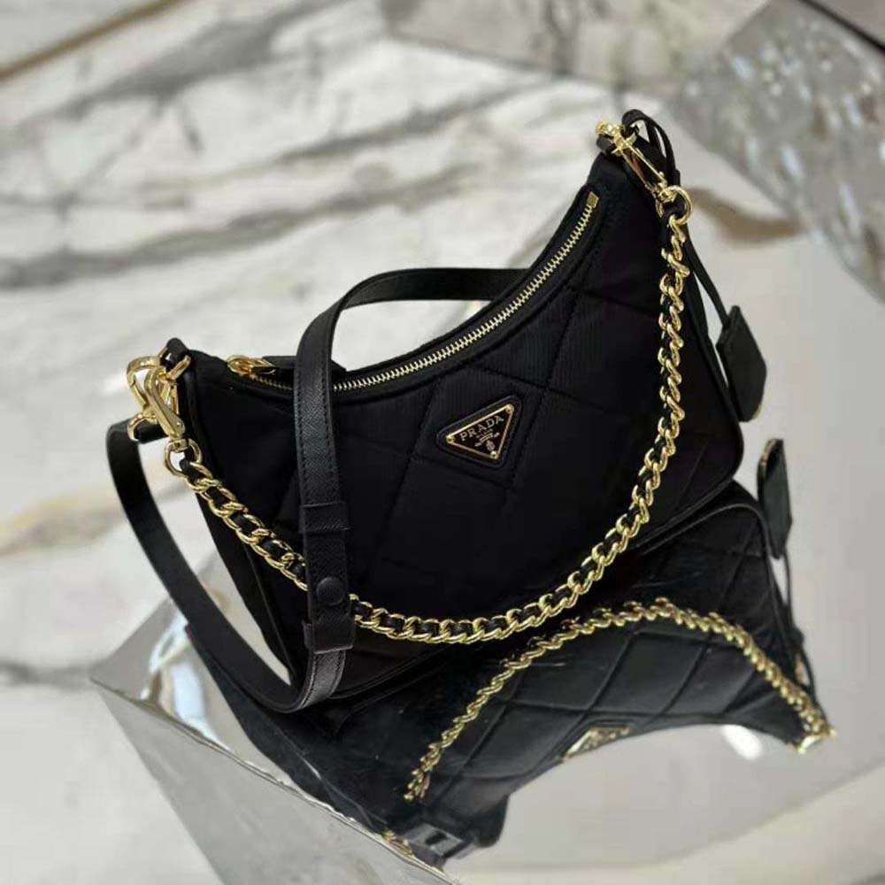 Side angle showing texture of Prada Women Re-Edition 1995 Mini-bag in black