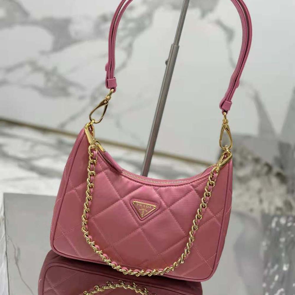 Close-up of silver chain and logo plaque on Prada Women Re-Edition 1995 Mini-bag