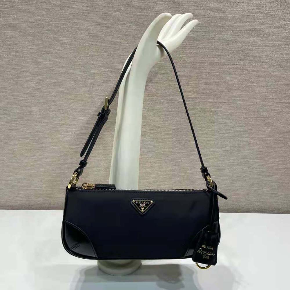 Close-up of brushed leather and silver hardware on Prada Women Re-Edition 2002 bag