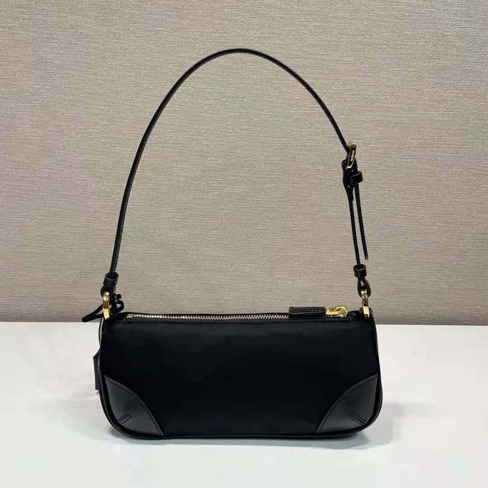 Side angle showing adjustable strap on Prada Women Re-Edition 2002 shoulder bag