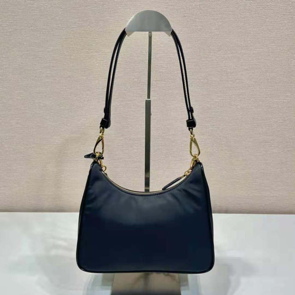 Side view showing compact silhouette of Prada Women Re-Nylon mini-bag
