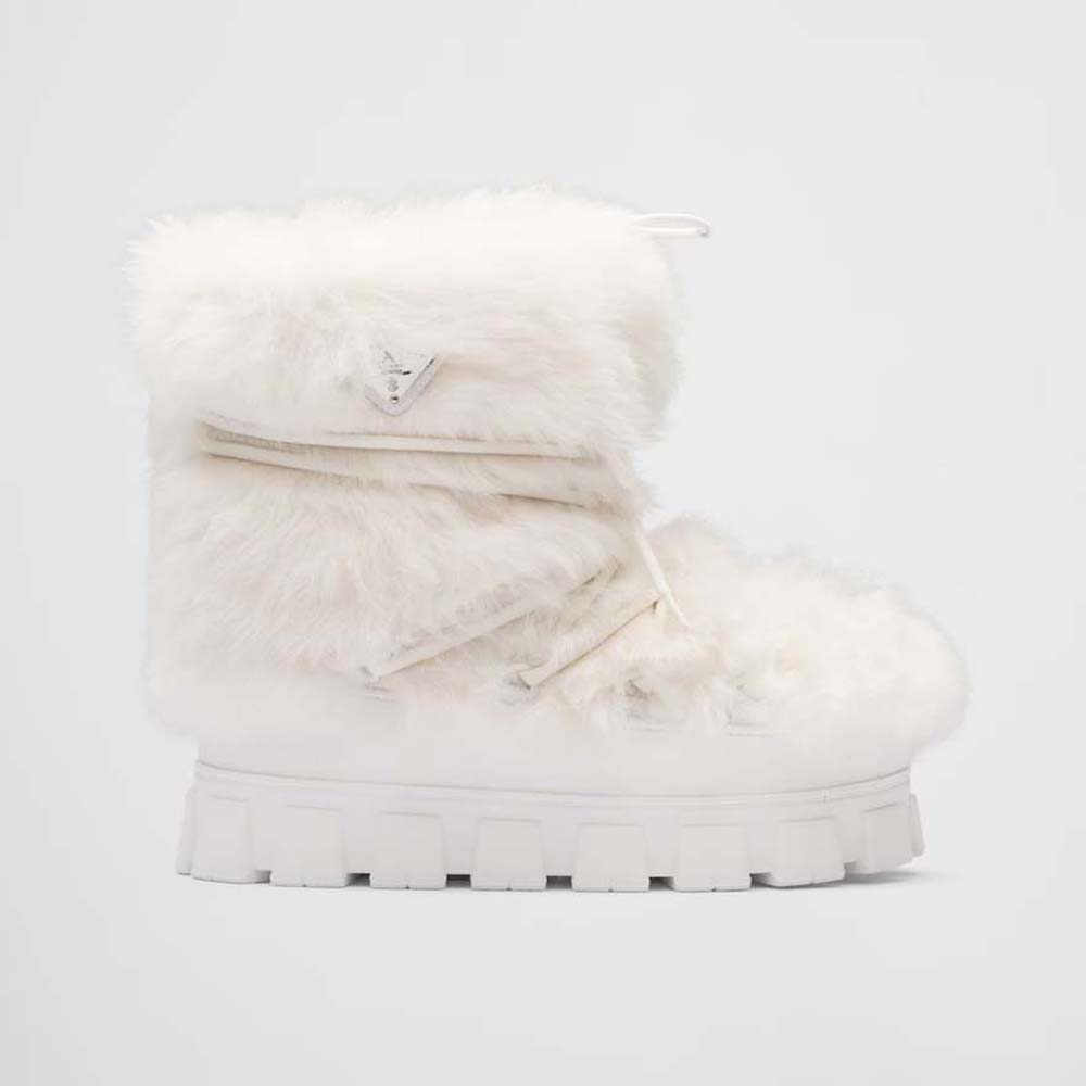 Side profile of Prada Women Shearling Apres-ski Boots-White showing lace-up detail
