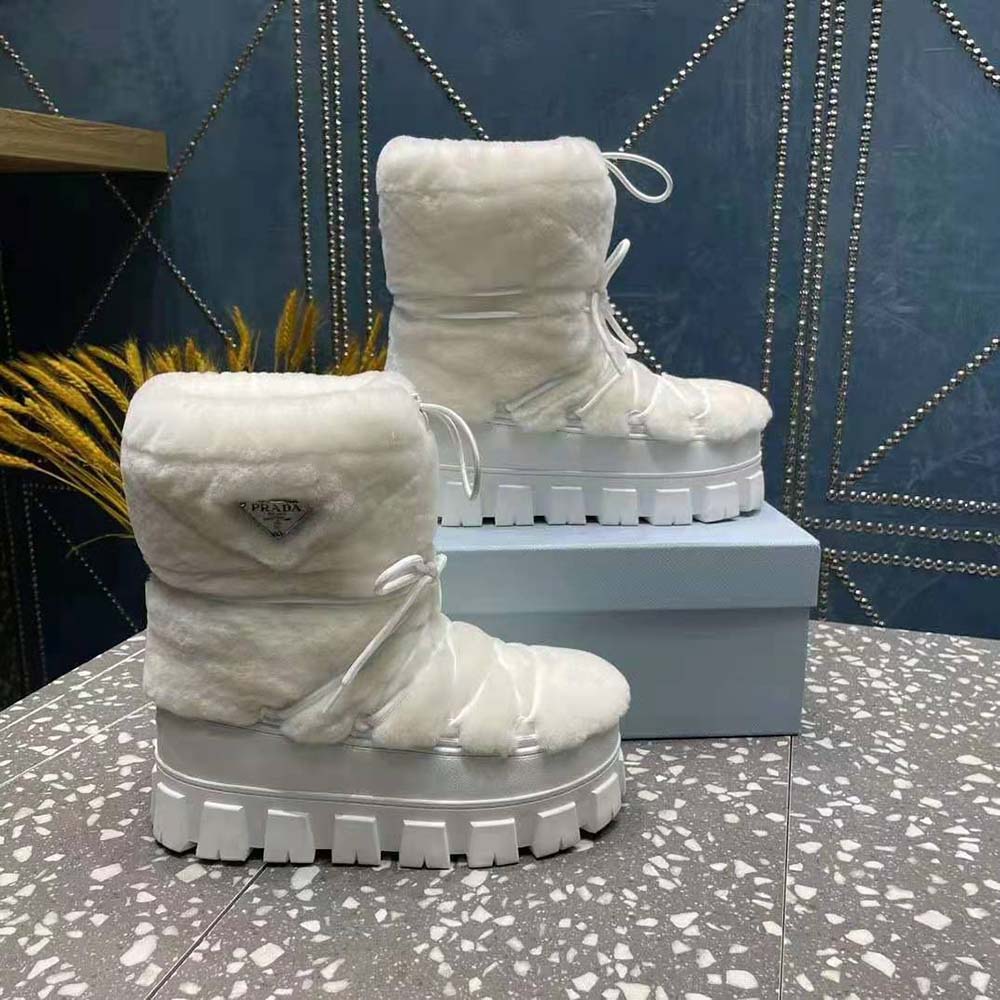 Close-up of plush shearling lining in Prada Women Shearling Apres-ski Boots-White
