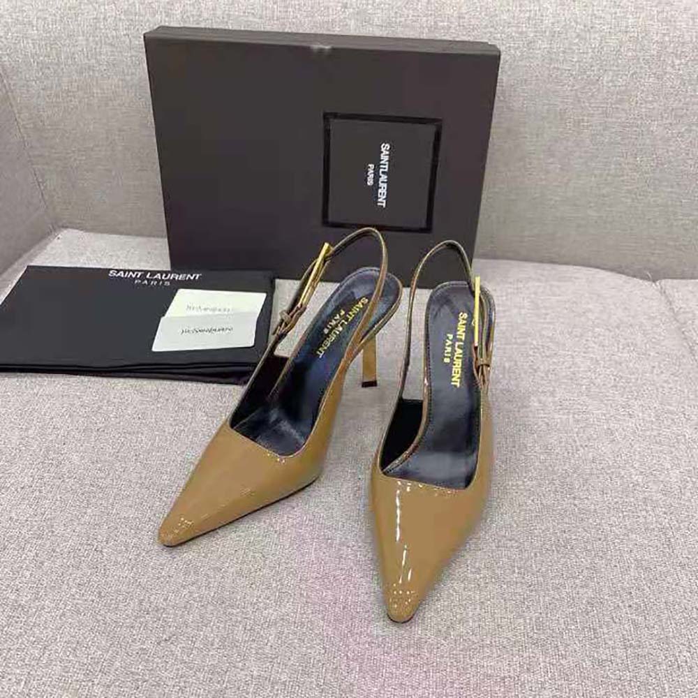 Close-up on gold YSL monogram hardware on Lee Slingback Pumps brown leather