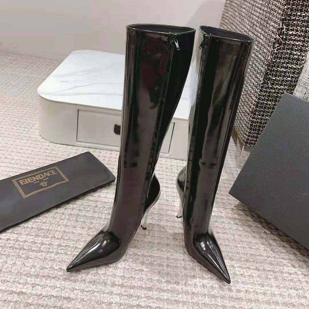 Close-up on gold Medusa hardware detail of Versace Women Pin-point Knee-high Boots