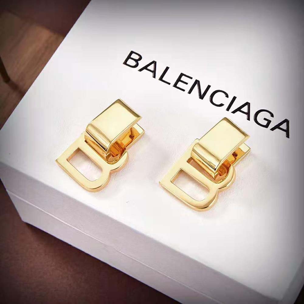 Close-up detail of gold brass finish on Balenciaga Hourglass Earrings