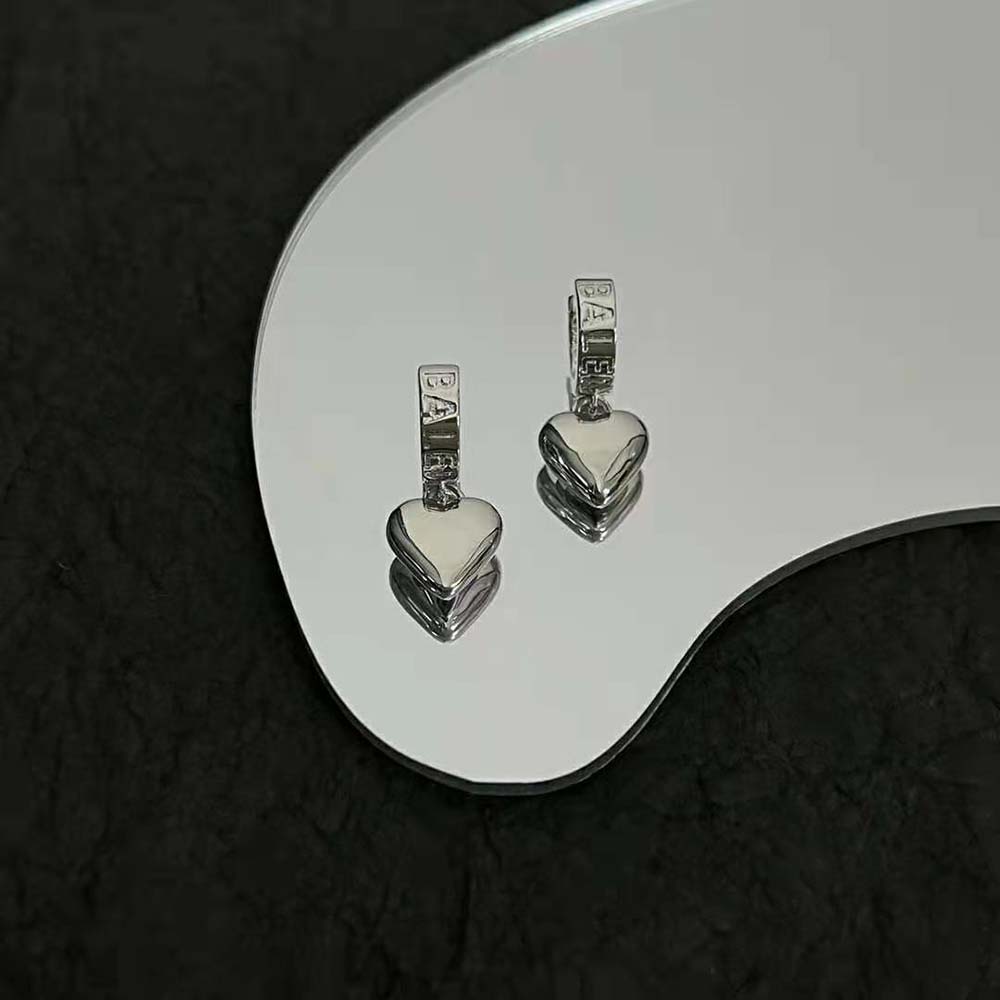 Side view of silver Balenciaga Women Sharp Heart Earrings with push-back closure