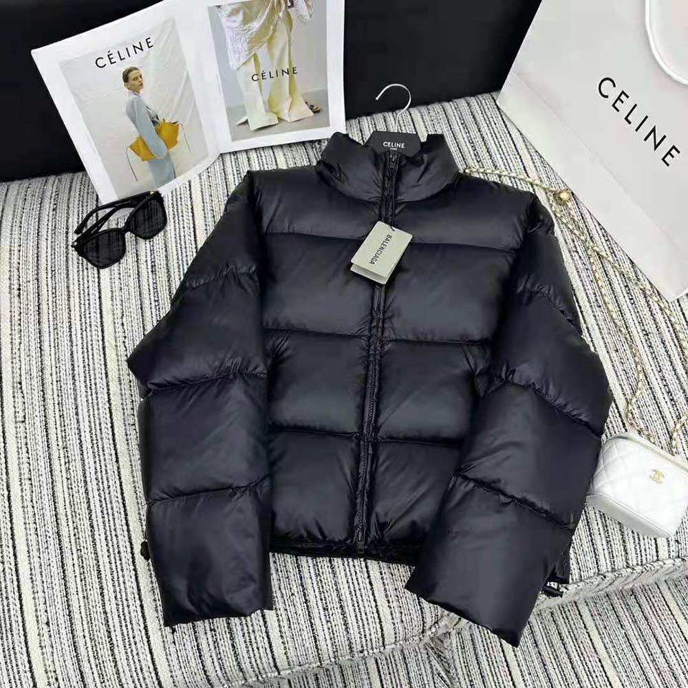 Close-up of zipper and Balenciaga logo hardware on black puffer