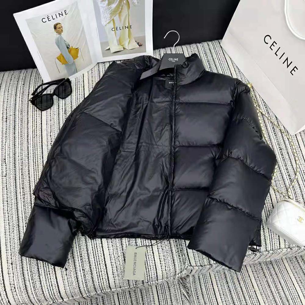 Side profile showing tailored shrunk fit of Balenciaga men's coat