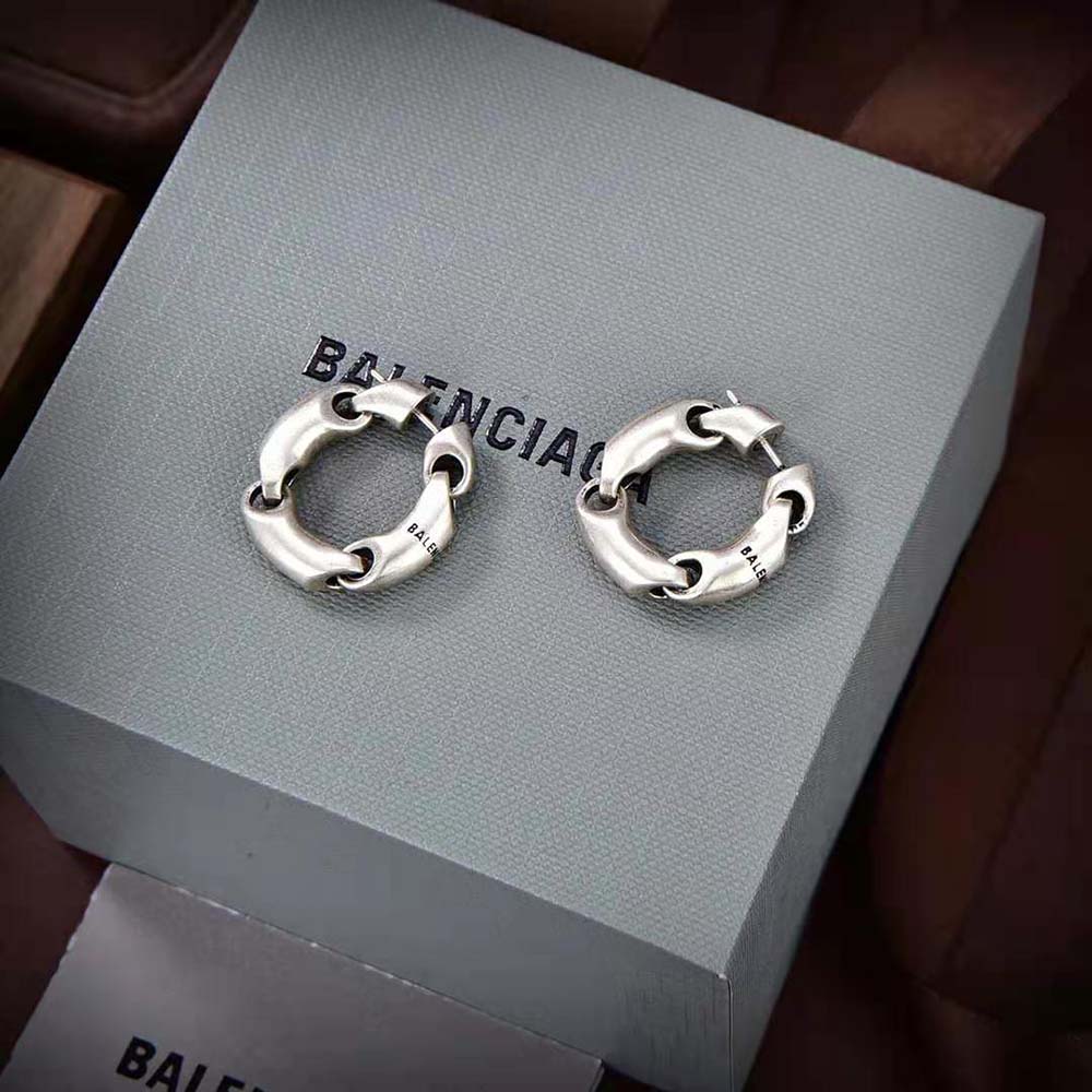 Side angle showing silhouette of Balenciaga Women Solid 2.0 Earrings