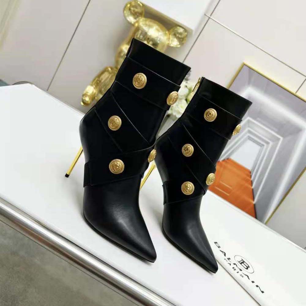 Rear angle detail of Balmain Women Alma Leather Ankle Boots-Black heel and zip