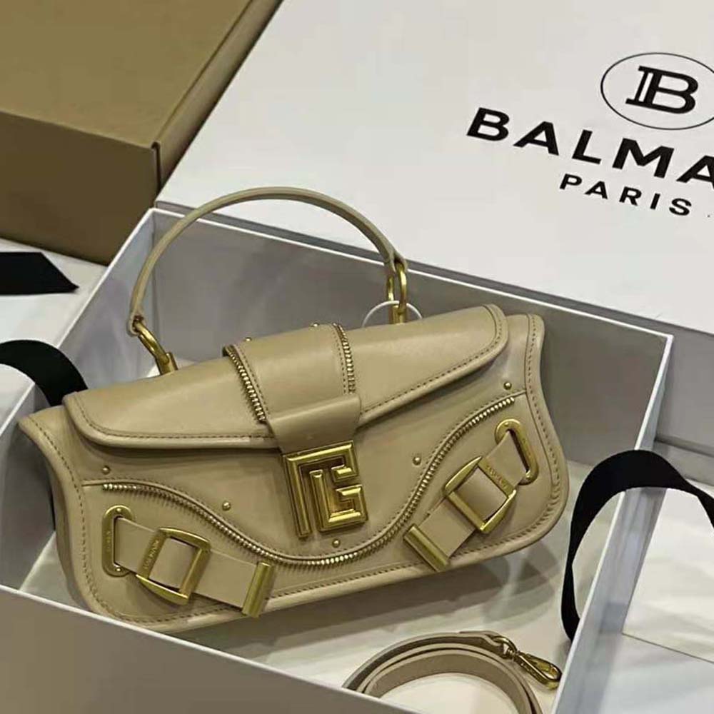 Close-up of gold hardware detail on Balmain Women Blaze Clutch Bag
