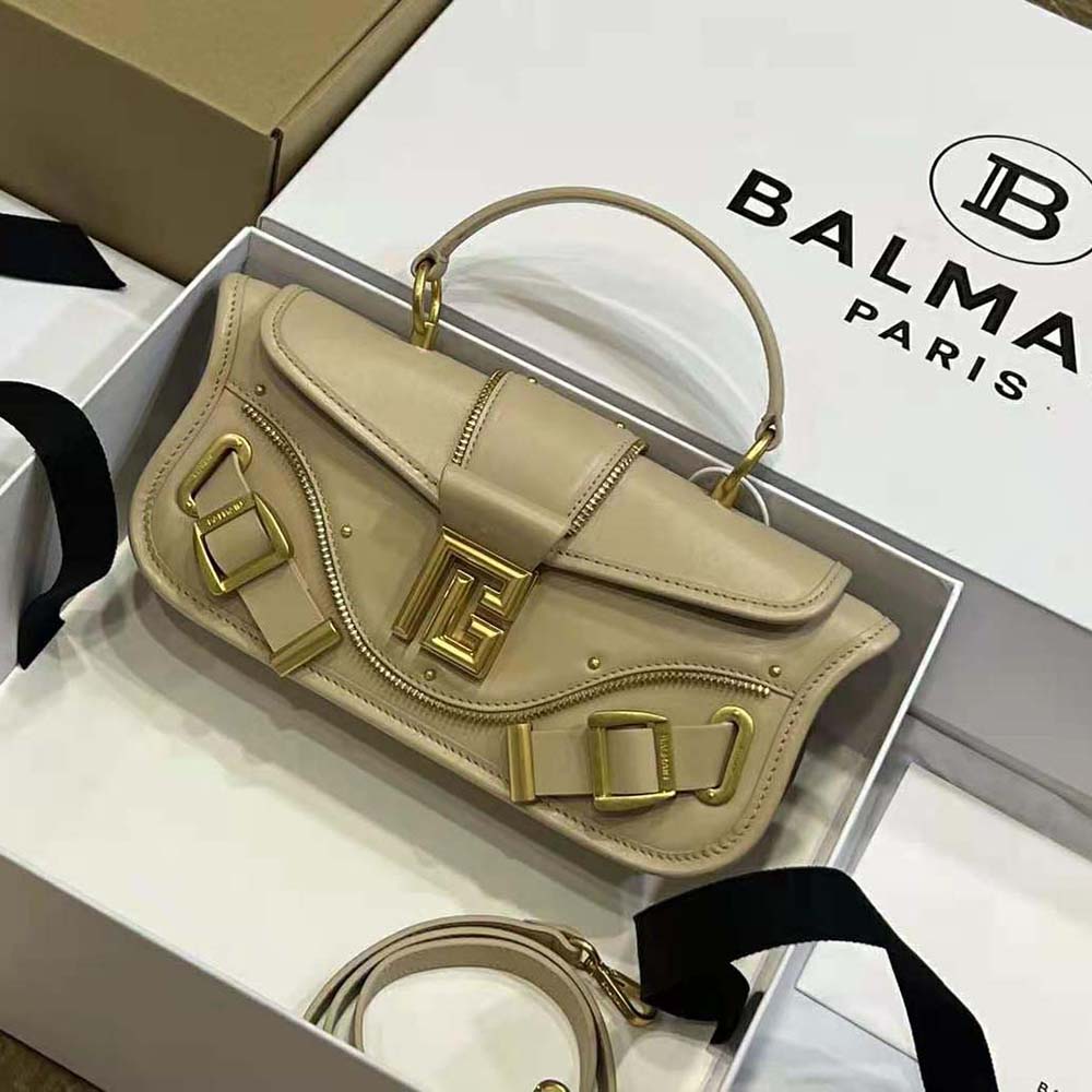 Side angle showing silhouette of Balmain Women Blaze Clutch Bag beige