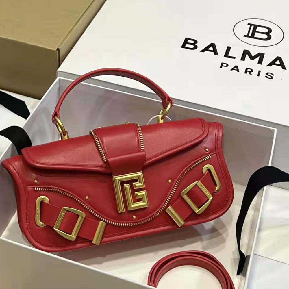 Close-up on gold-tone clasp detail of Balmain Women Blaze Clutch Bag