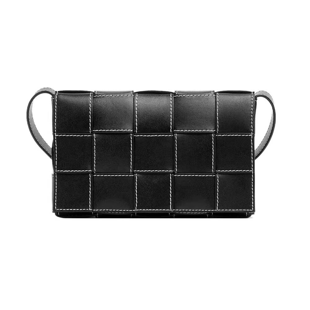 Close-up detail of black intreccio leather and gunmetal hardware on Bottega Veneta bag