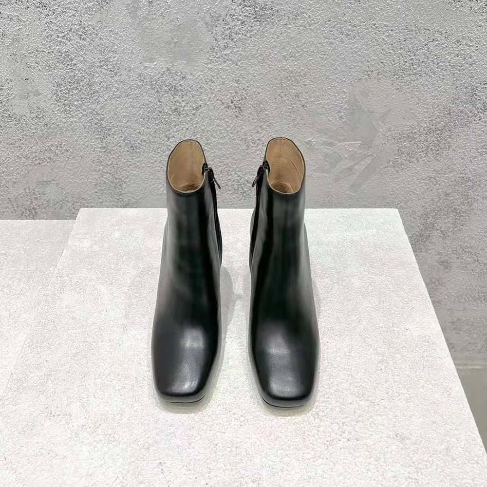 Close-up of black leather and signature knot on Bottega Veneta ankle boot
