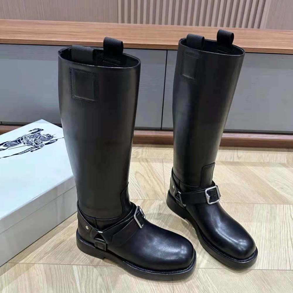 Front angle of Burberry Women Leather Saddle Tall Boots-Black with laced closure