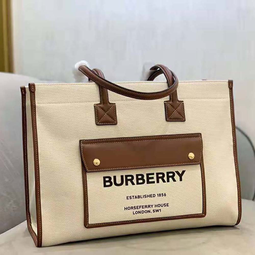 Close-up detail of beige coated canvas and signature Burberry check