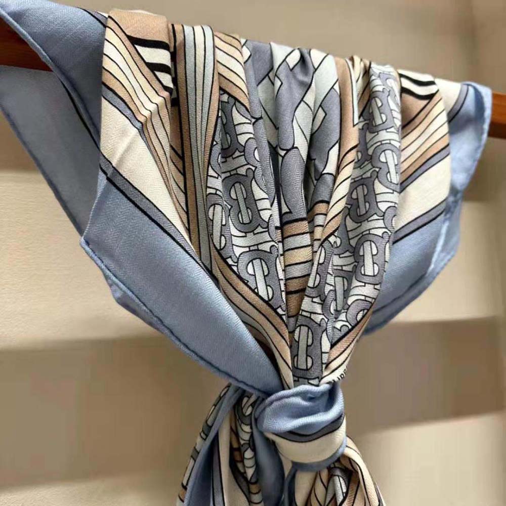 Model wearing Burberry Women Montage Print Silk Square Scarf-Blue styled around neck