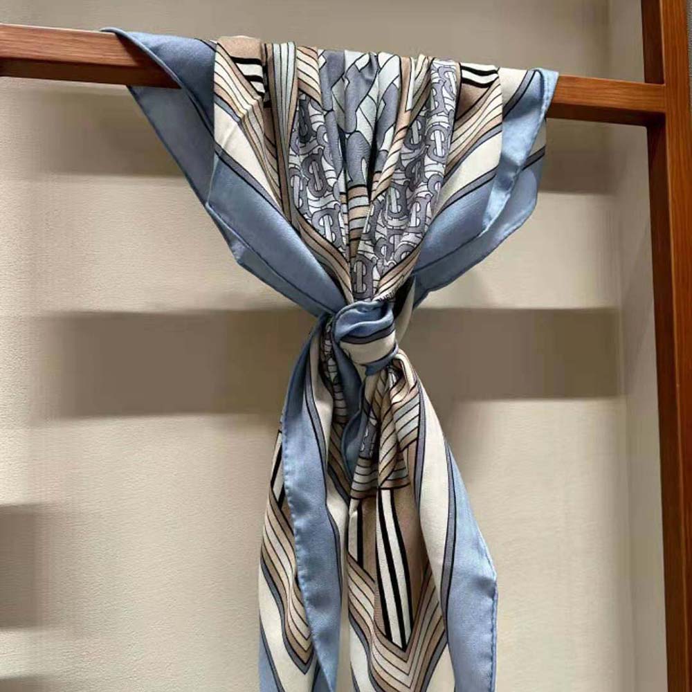 Close-up detail of Burberry Women Montage Print Silk Square Scarf-Blue fabric texture