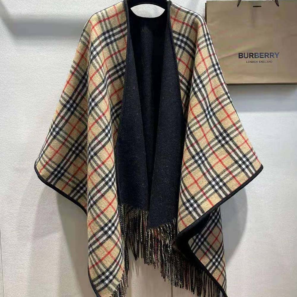 Detail of branded closure hardware on Burberry reversible wool cape