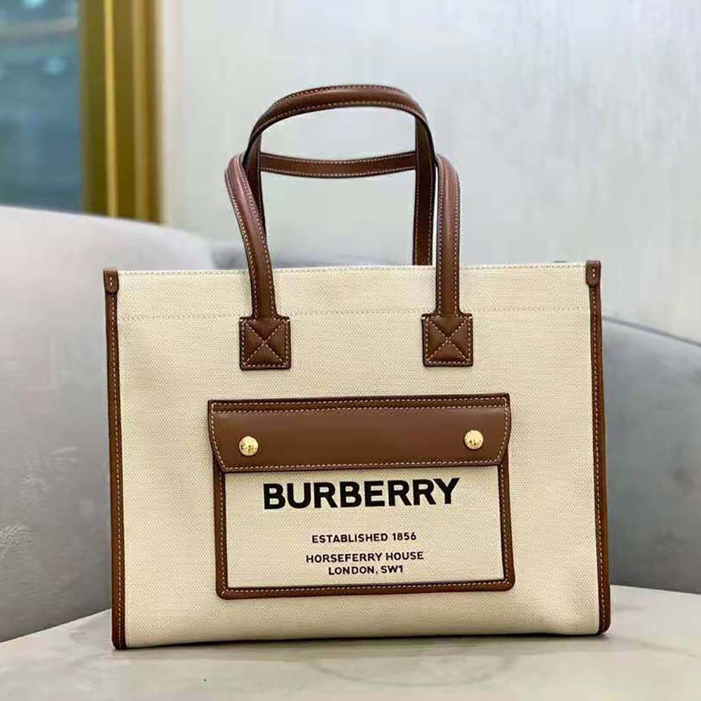 Close-up of beige leather and gold-tone hardware on Burberry Small Freya Tote