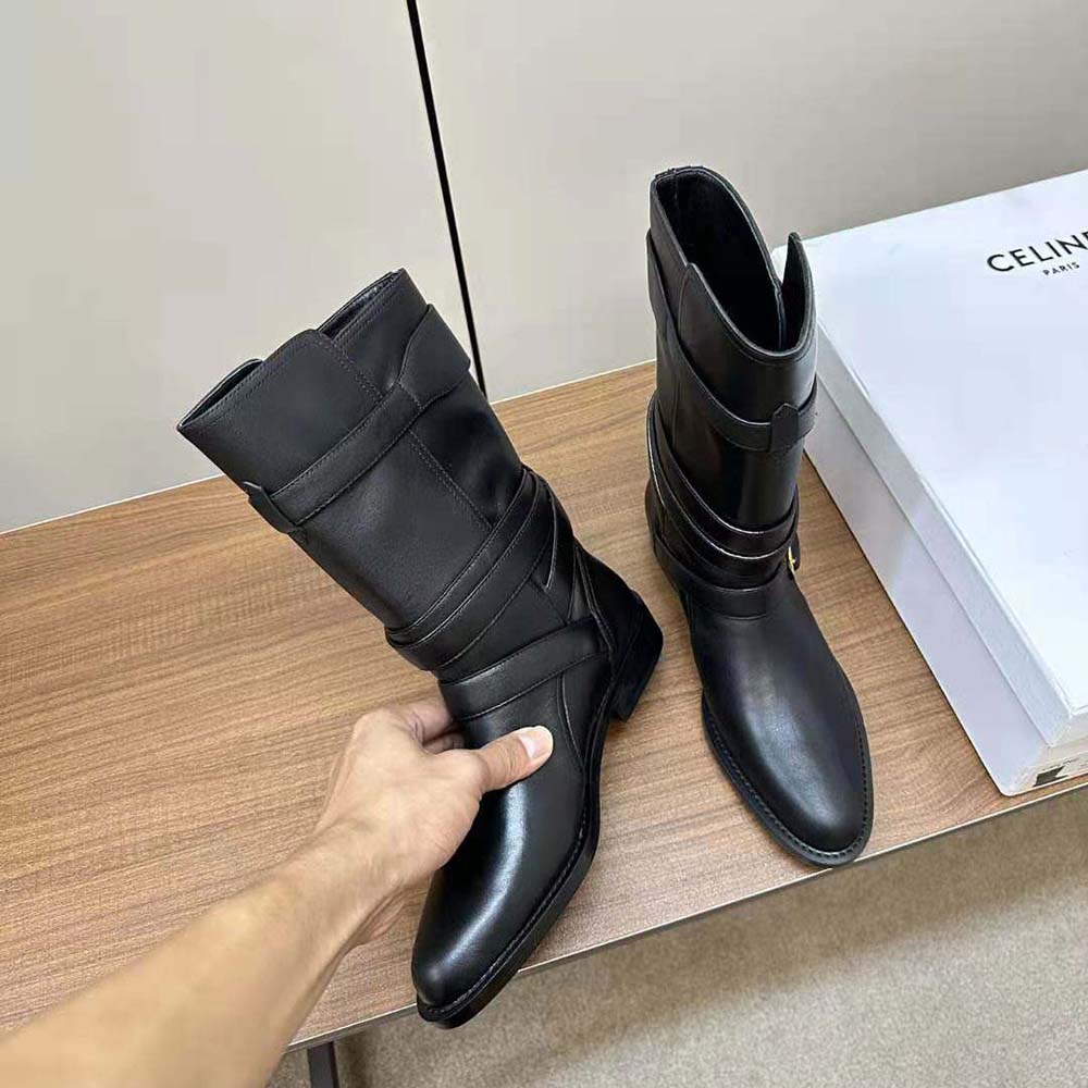 Top-down angle showing smooth black calfskin leather on Celine Lyra boot